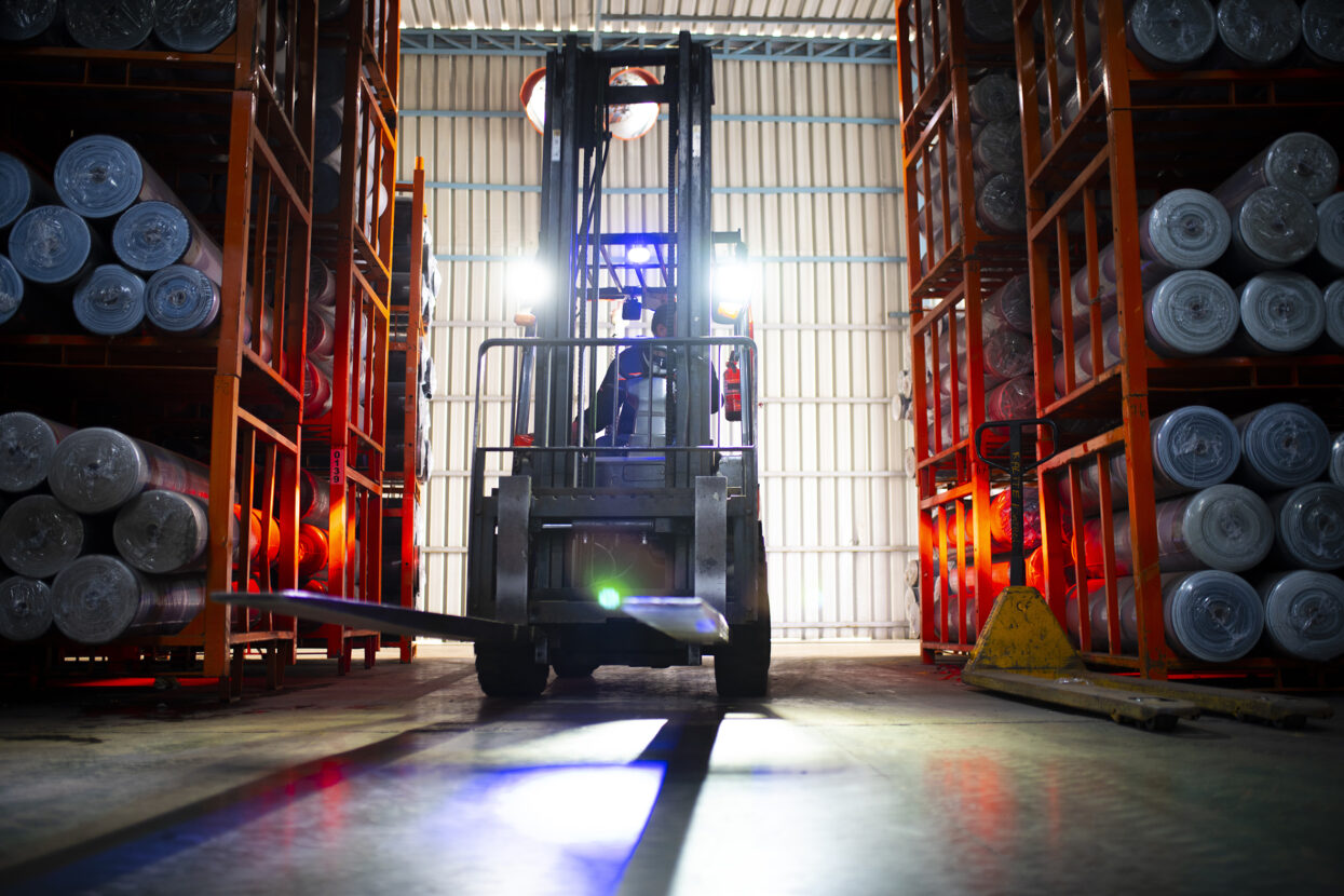 Forklift loader. Pallet stacker truck equipment textile factory