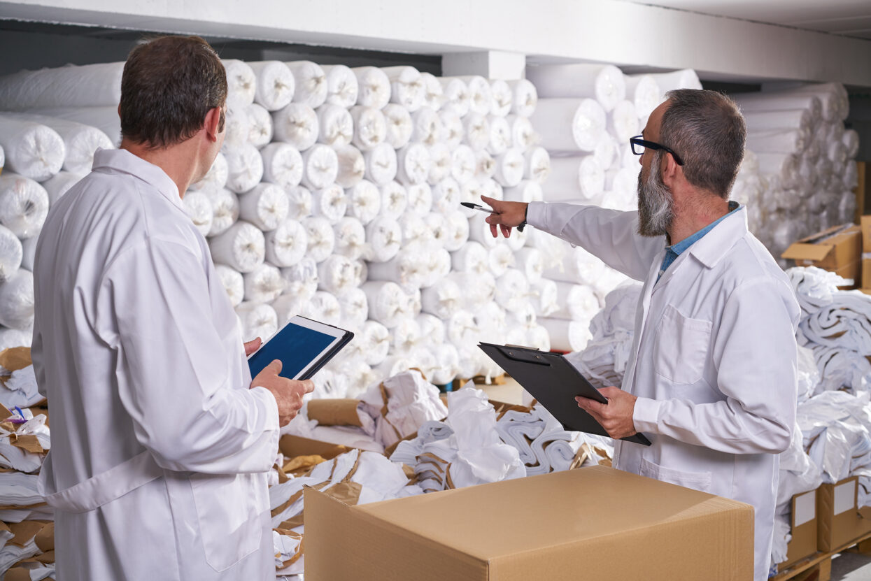 warehouse supervisor and manager men with textile