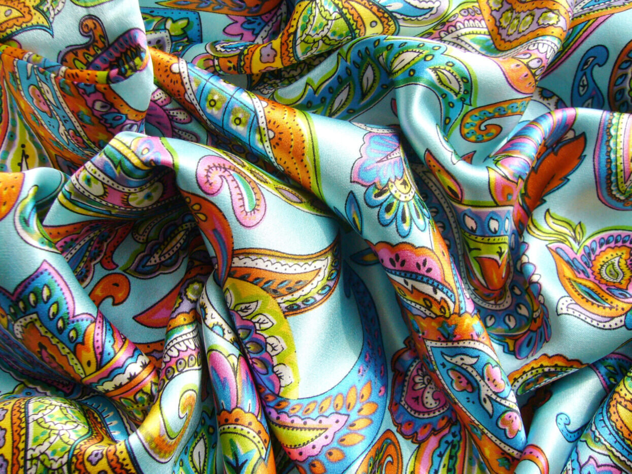 Blue silk fabric with drapery. The texture of the fabric. Natura