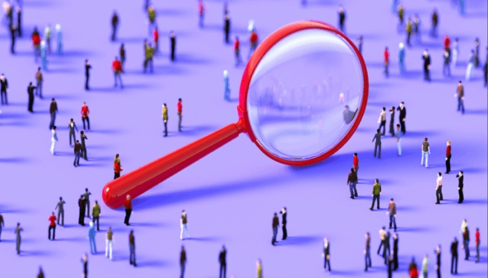magnifying glass looking at humans